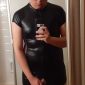 Selfie with Pornography He is standing in front of the mirror while donning the black attire.
