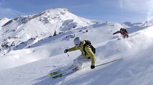 The image depicts a snowy landscape with two boys on snow skis.