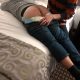 Adult Disgraceful Diapering the other man while he is lying on the bed and exposing his butt